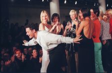 Isaac Mizrahi takes a bow on the runway with his models at the showing of his 1997 Spring collection in New York Thursday Oct. 31, 1996.