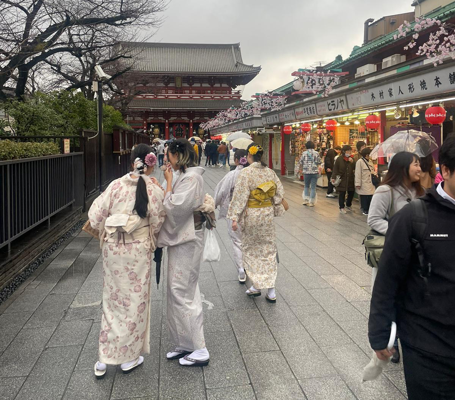 Street scene showing women wearing traditional kimonos