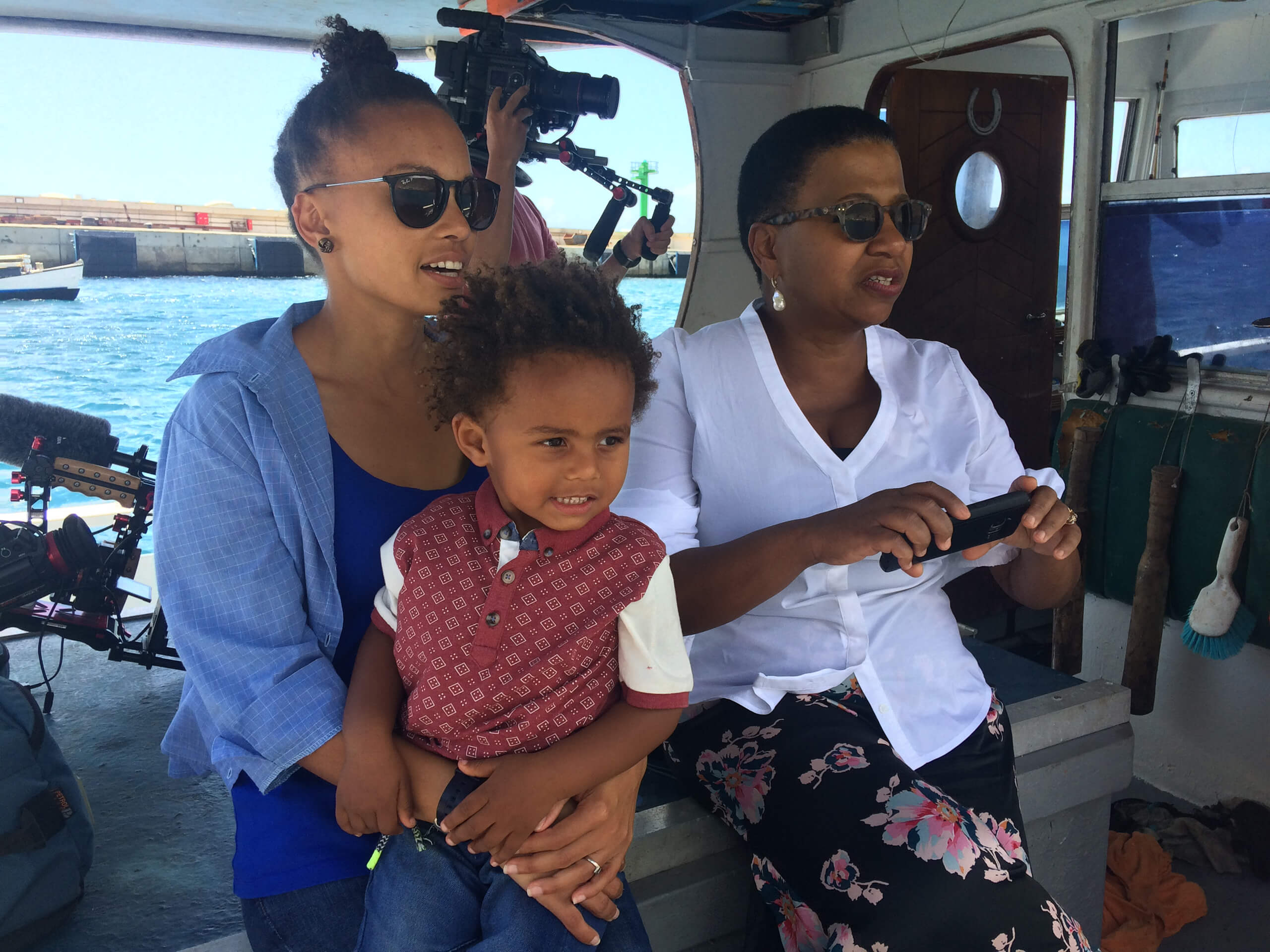 Peggy King Jorde with Annina van Neel and son on a boat in St. Helena, UK