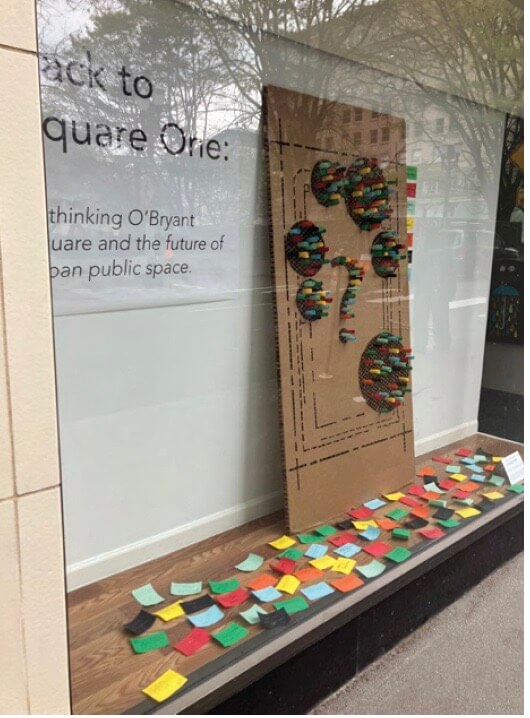 Window showing display of Back to Square One ideas from community meetings