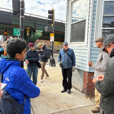 Kannan on tour showing corner of neighborhood with Expressway in the background