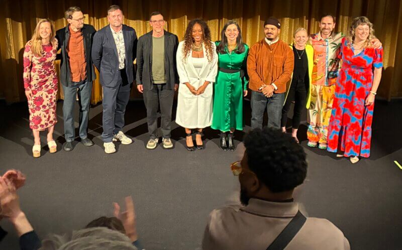 The 10 2026 Loeb Fellows receiving an ovation after their presentation.